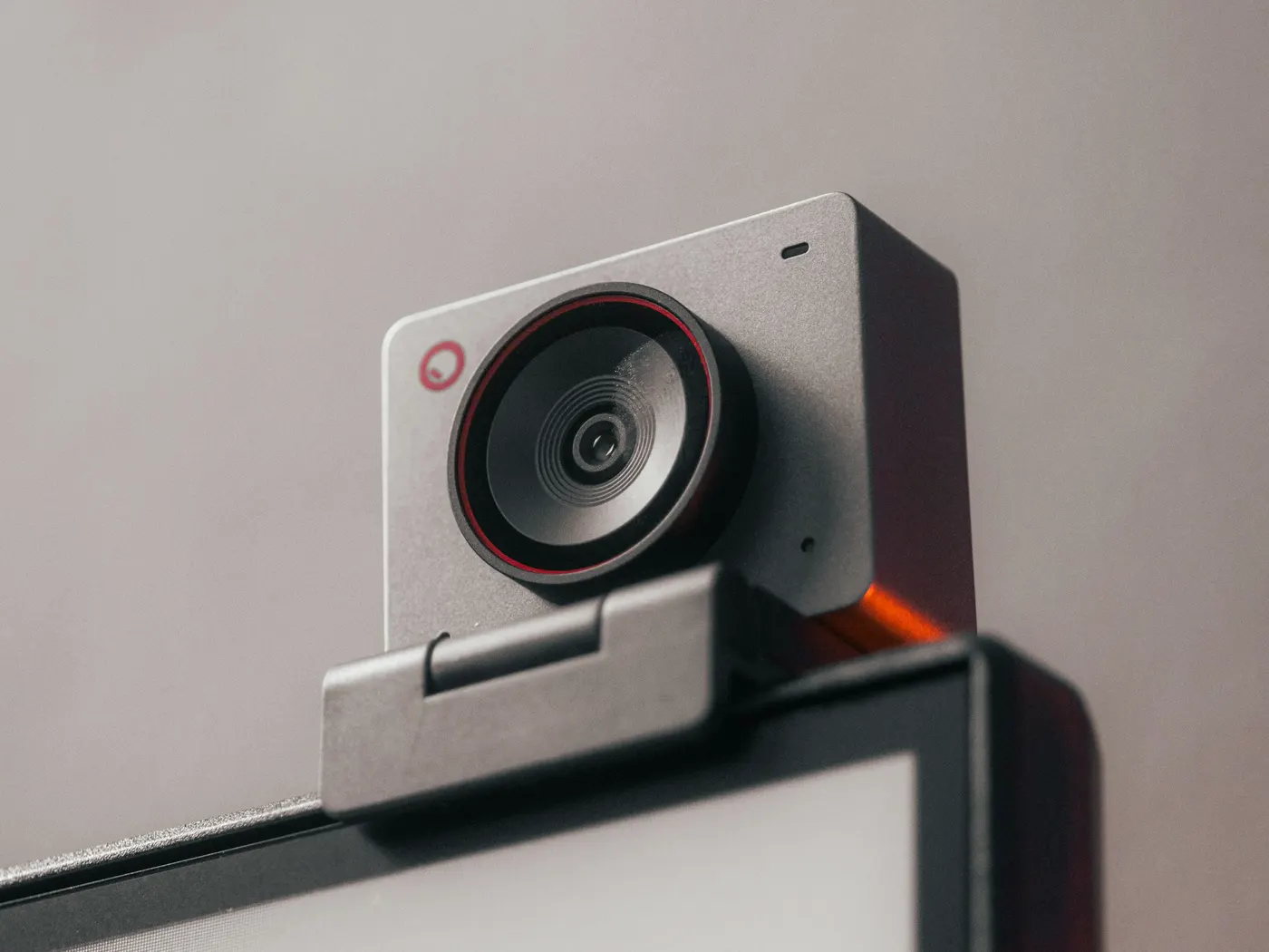 A compact webcam clipped to the top edge of a computer monitor