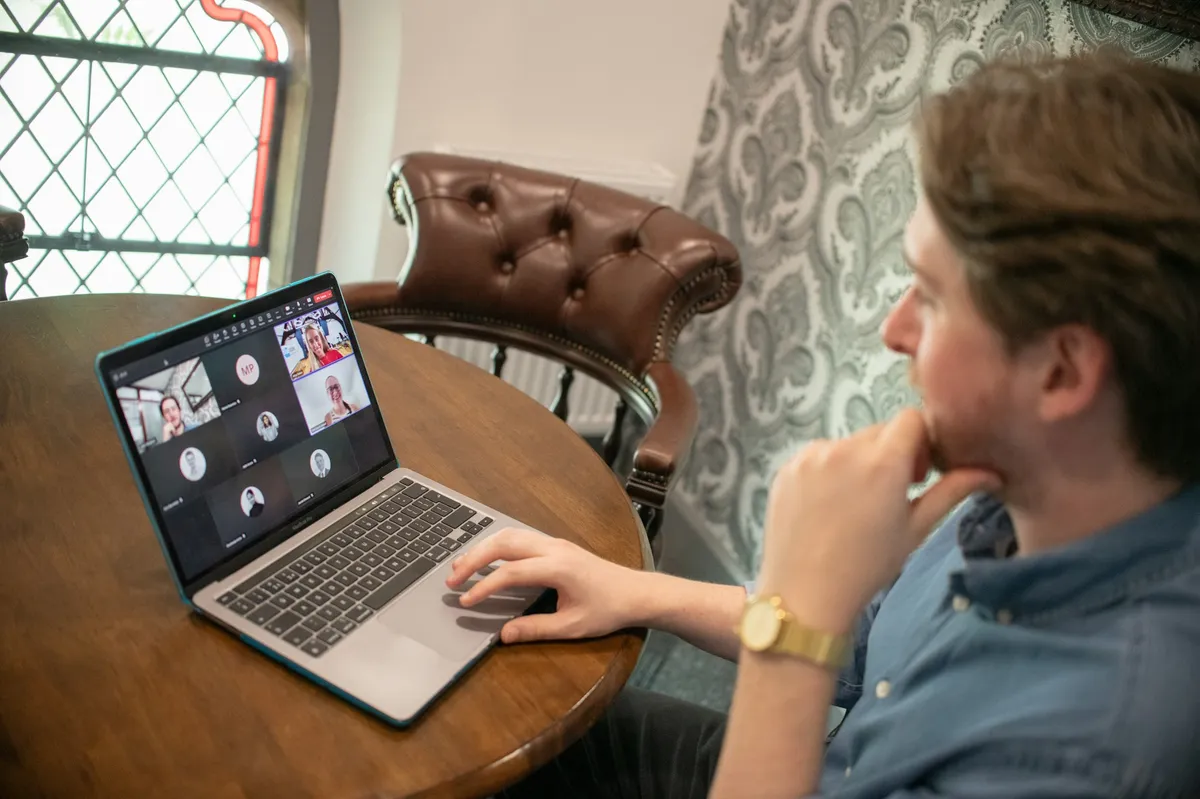 A man on a video call on his laptop