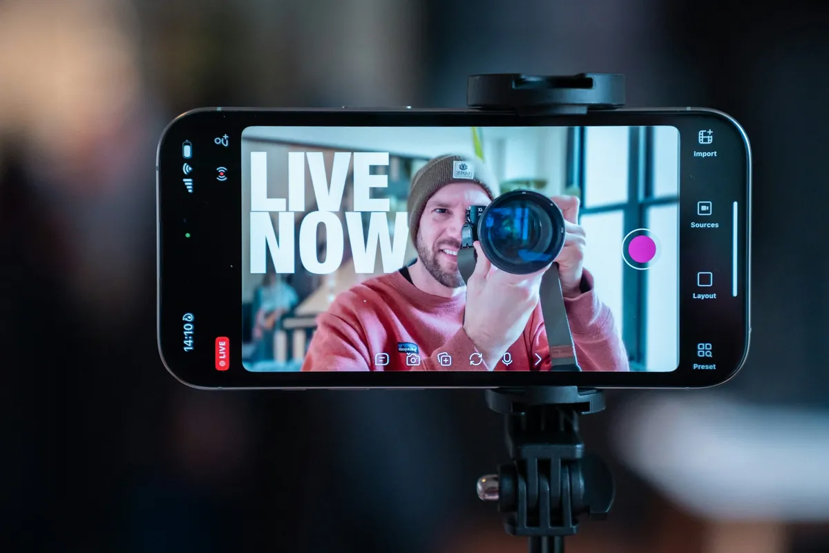 A phone on a stand streaming a live video